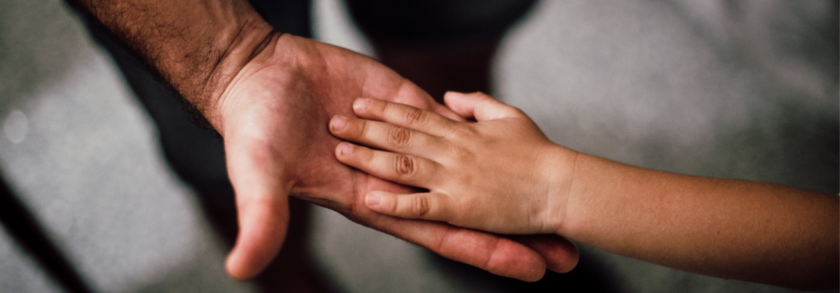 Dad hand and child hand touching